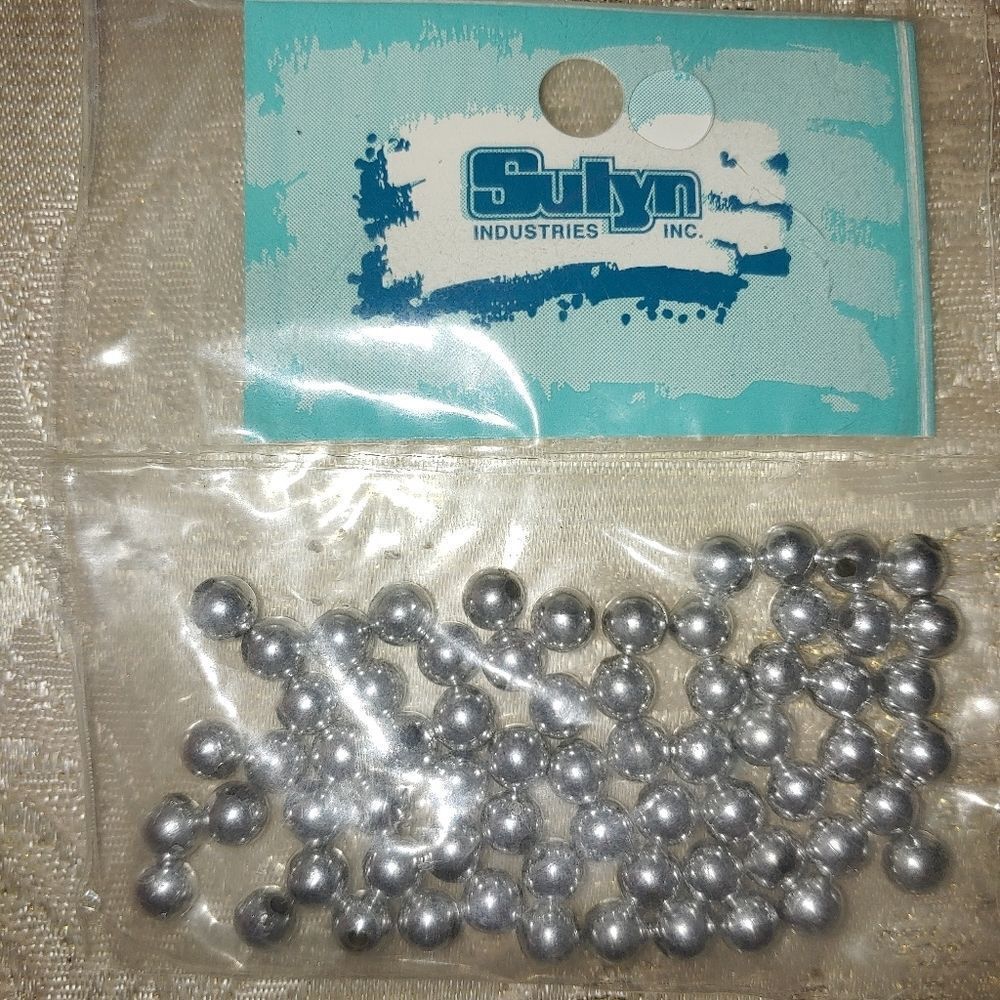 7 pkgs of Plastic Silver coated beads for jewelry making